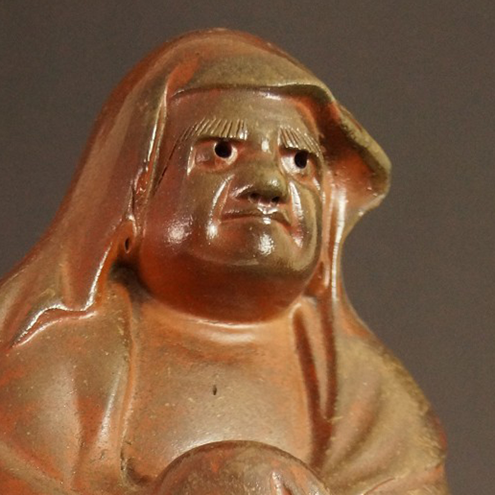 Bodhidharma Daruma figure made of Bizen ware motif close-up preview